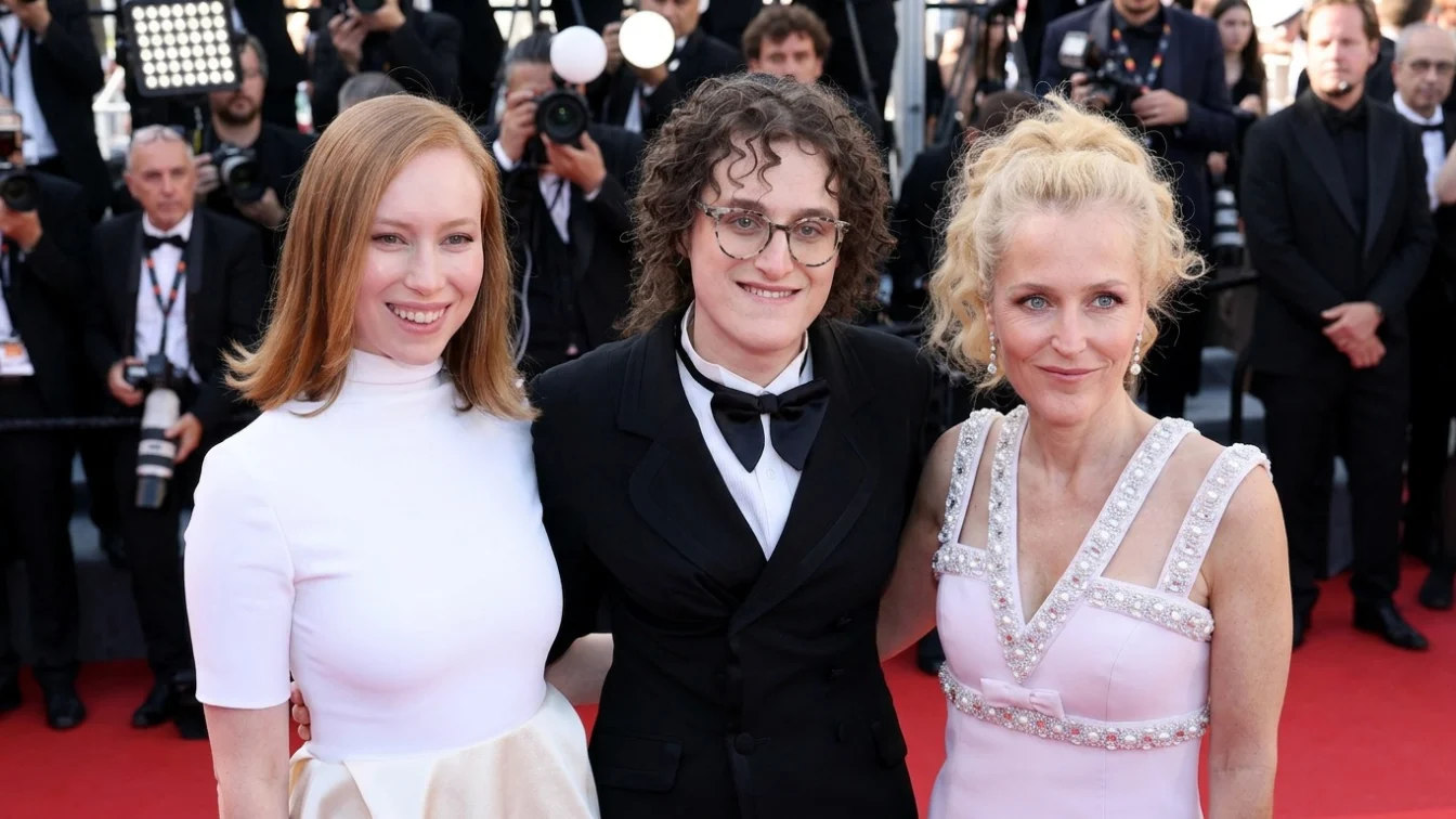 Hannah Einbinder, Jane Schoenbrun and Gillian Anderson pose for Cannes photographers on Wednesday, May 13 2026.