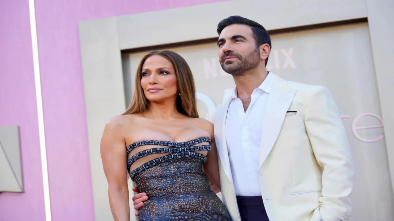 Jennifer Lopez and Brett Goldstein attend the Netflix's "Office Romance" world premiere at The Egyptian Theatre Hollywood on May 26.